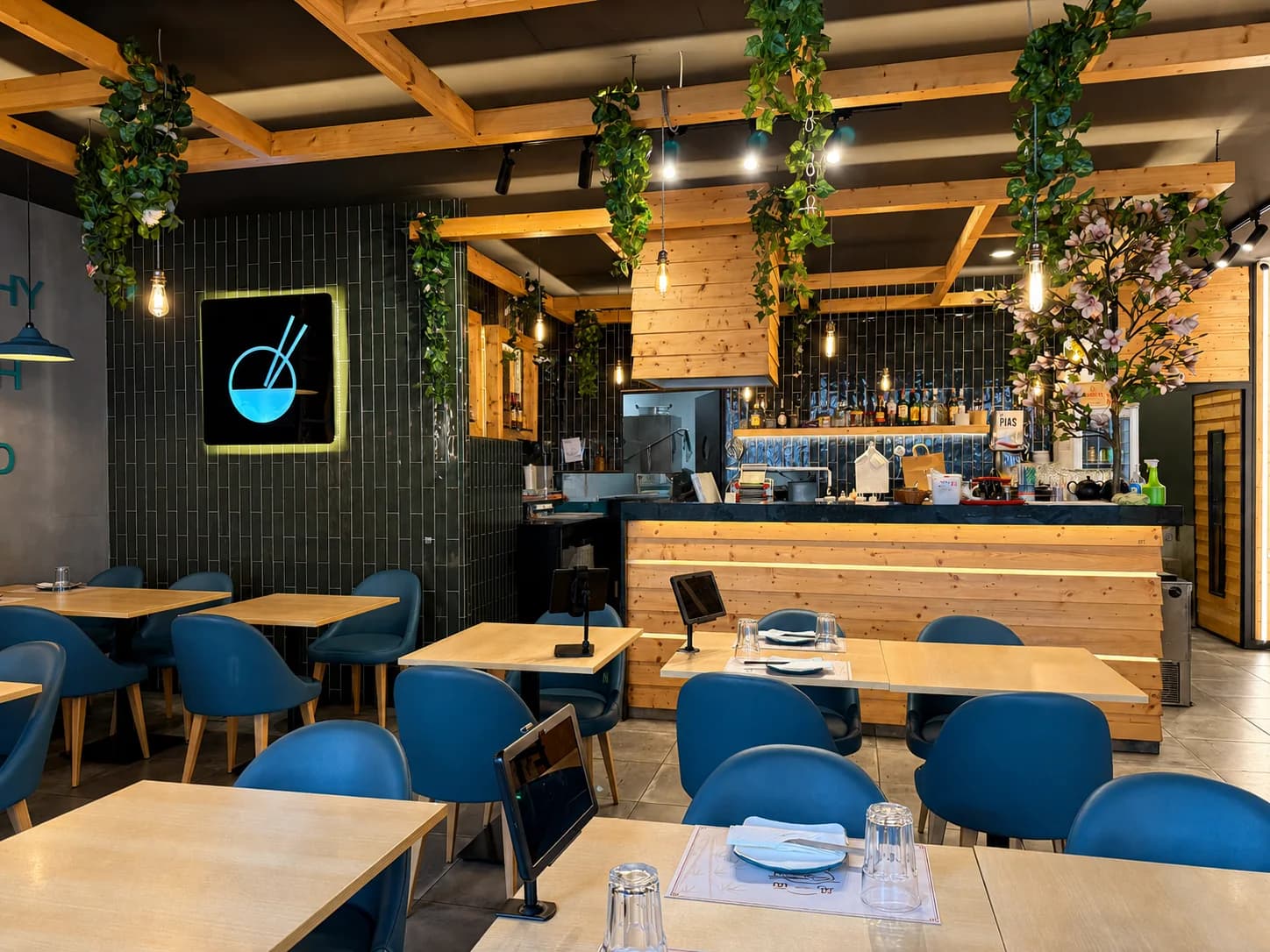 The warm wood interior of House Noodles in Lisbon